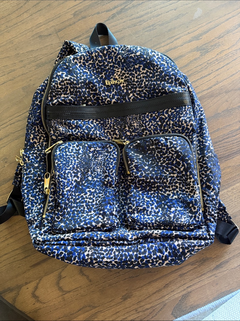 Kipling Navy and Black Leopard-Print Backpack with travel sleeve
